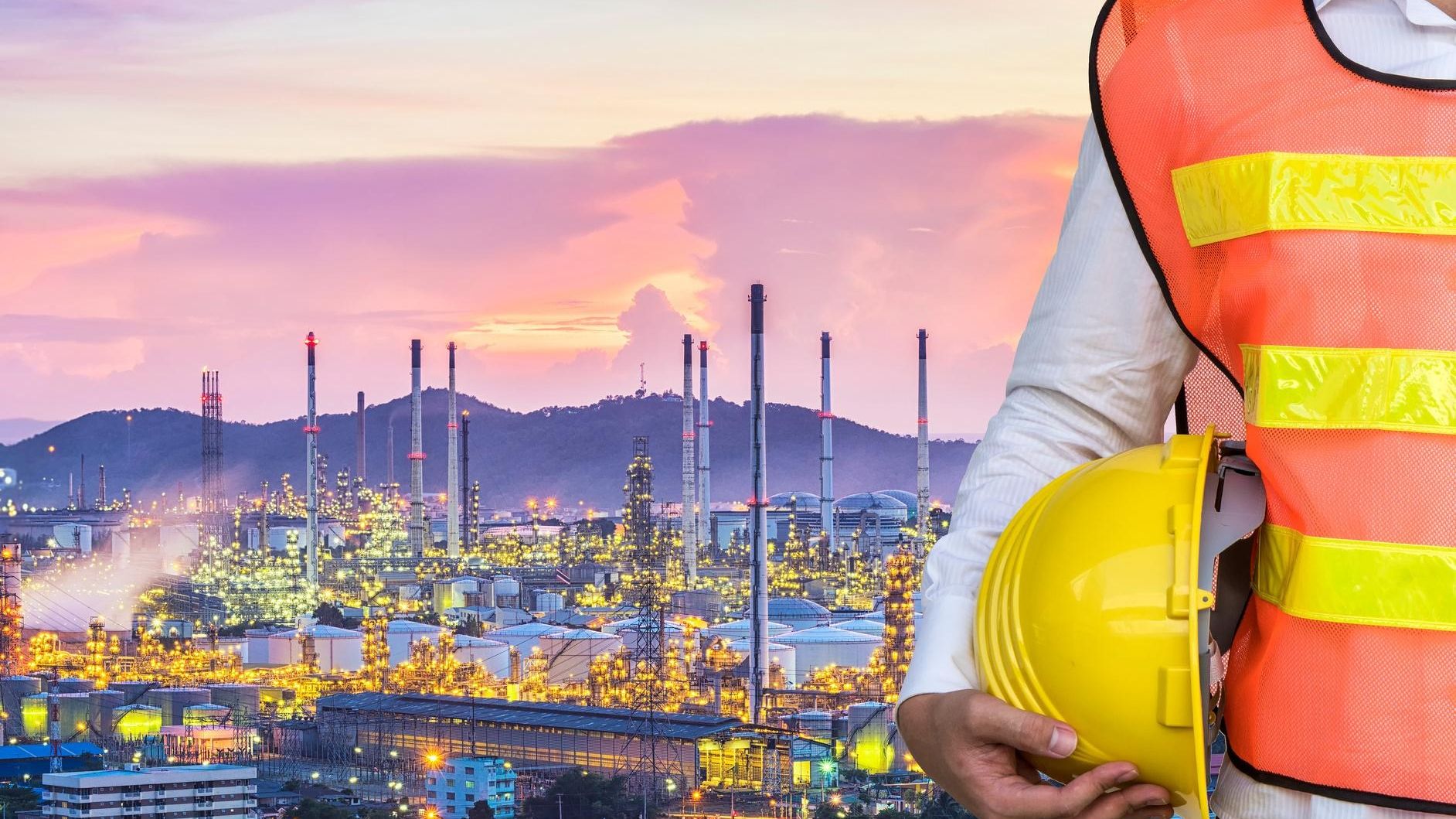 Refinery complex illuminated at dusk